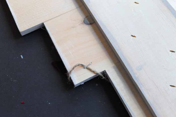 stapling banner to pallet Christmas tree
