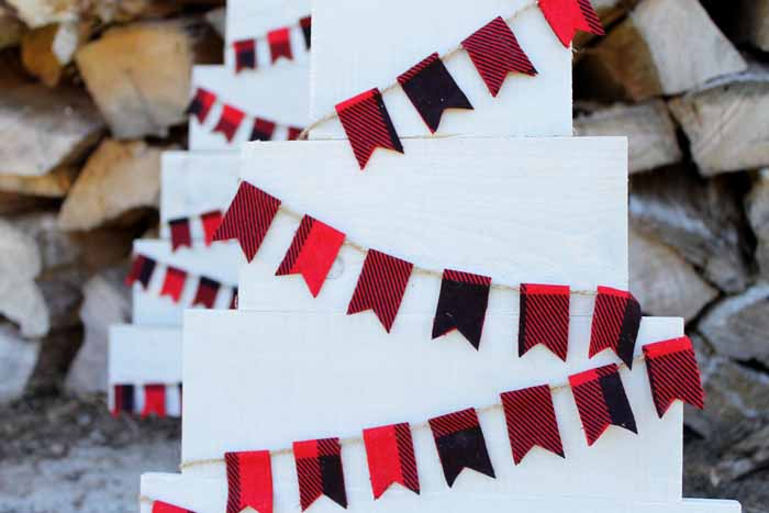 Plaid pennant banner on a pallet Christmas tree.