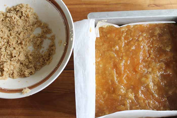 crust spread with pear preserves in a pan