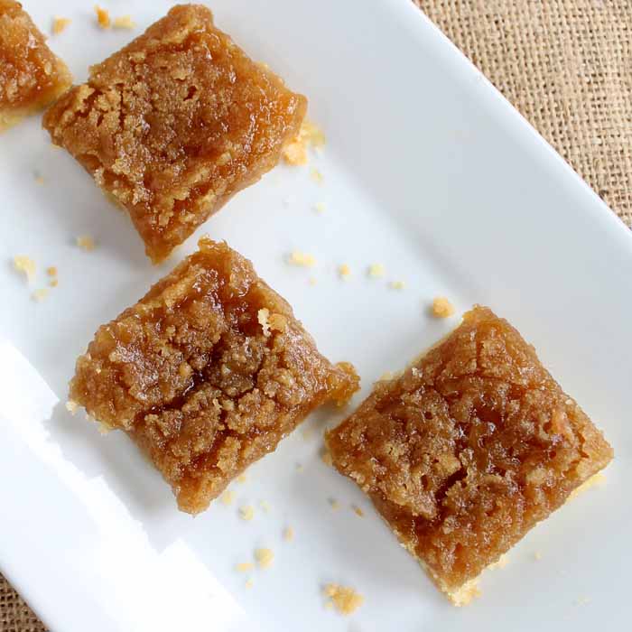 pear crisp recipe cut into squares on a plate