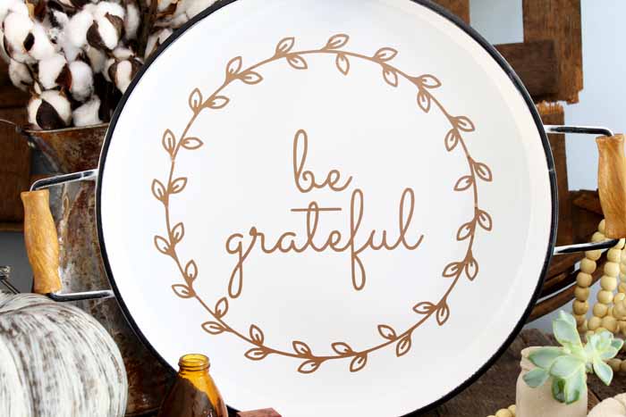 white plate with "be grateful" on it