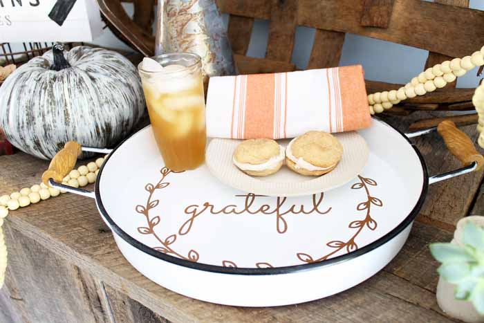 plate with glass of liquid and cookies 