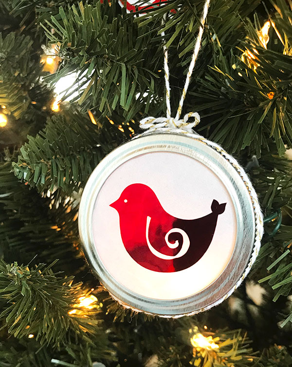 Christmas bird ornament on tree