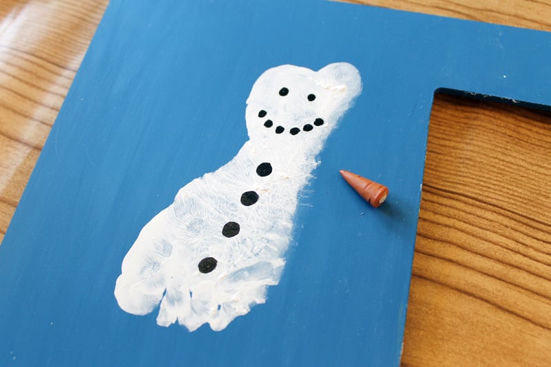 Homemade Photo Frame snowman footprint on a blue photo frame