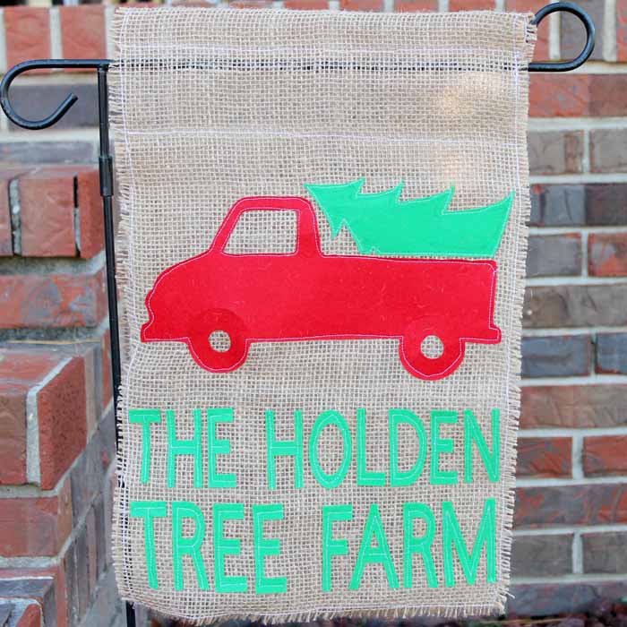 burlap christmas flag in front of a house