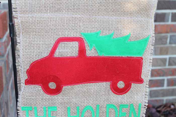 red truck outdoor holiday flag