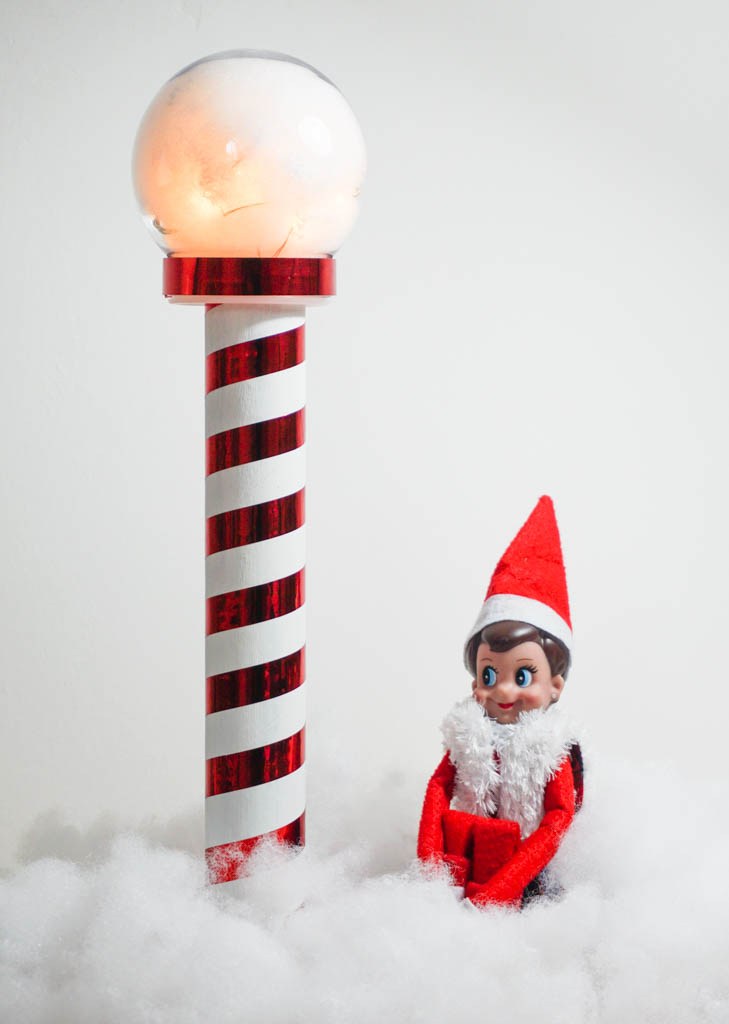 candy cane pole with light on the top