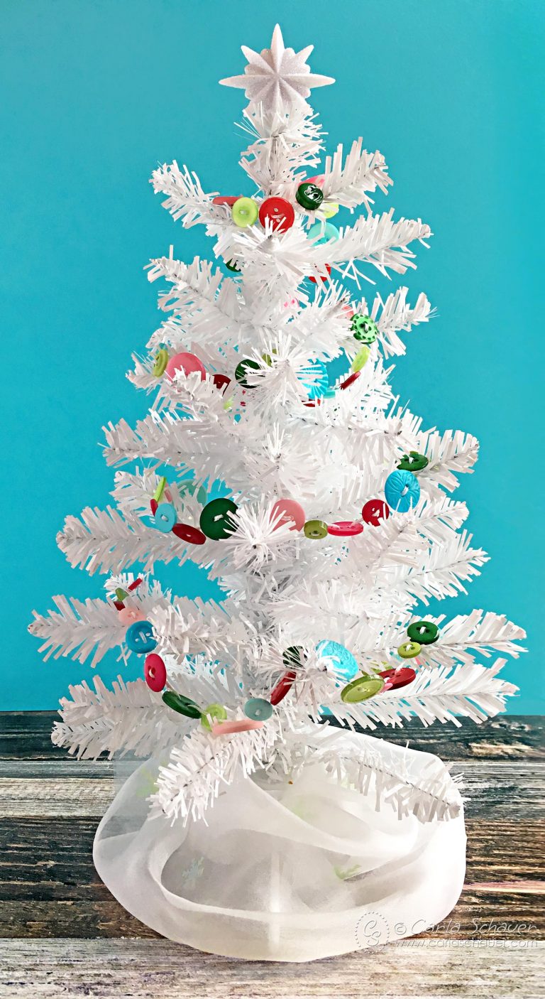 white tree with colorful garland