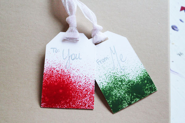 paper tags with paint splatter