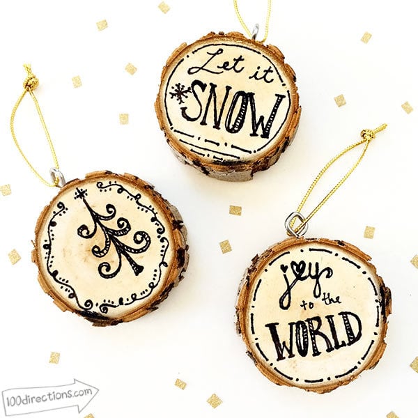 hand drawn ornaments on wood slices