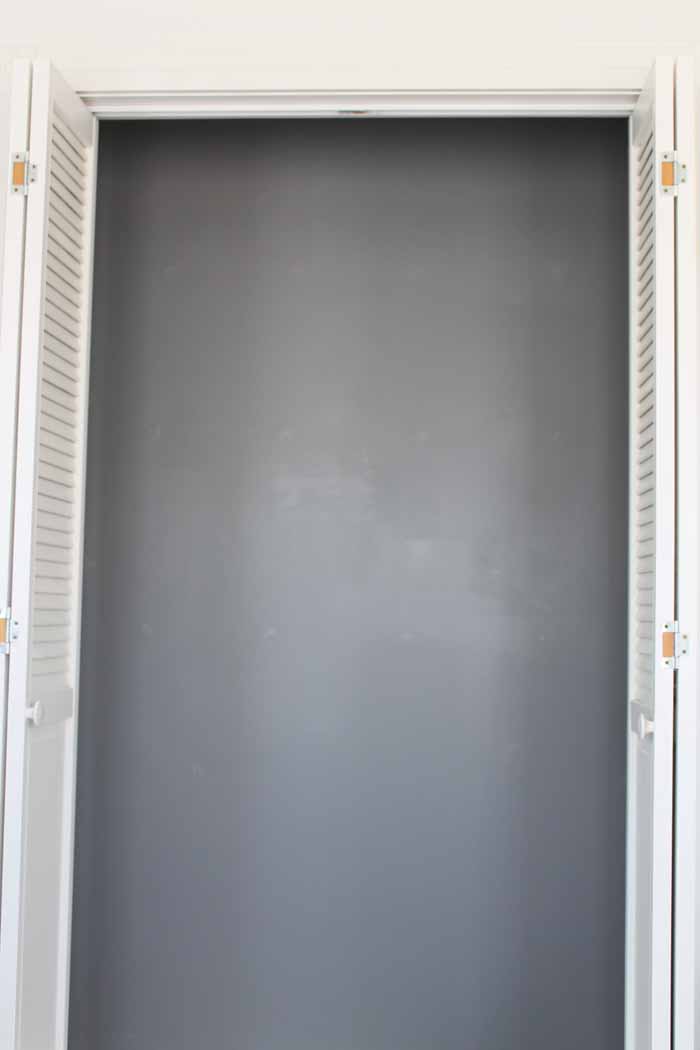 closet with back wall painted grey