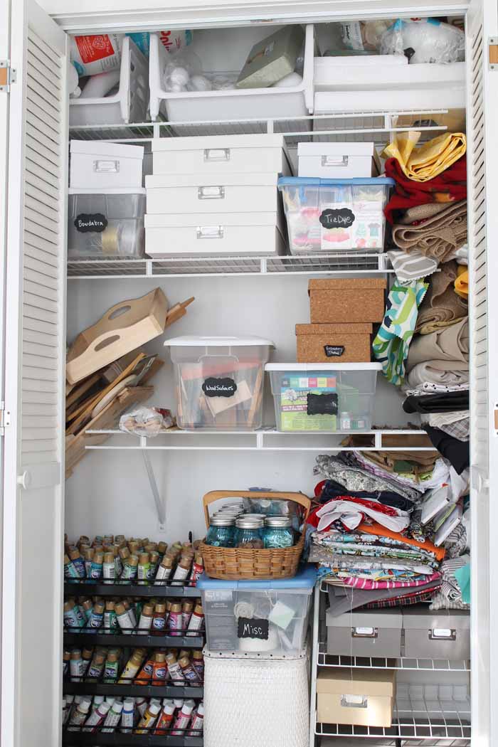 closet filled with craft supplies on wire shelves