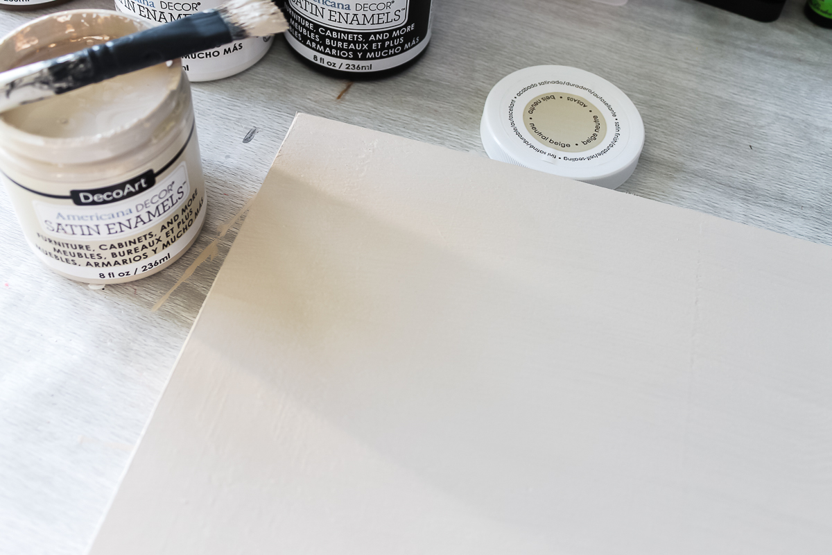adding paint to a wood panel