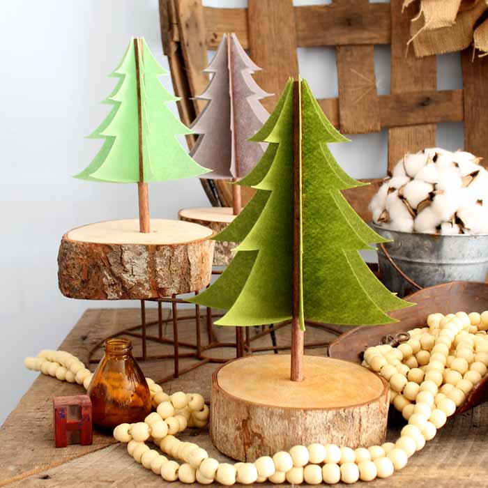 Make your own felt Christmas decorations! These easy felt trees are perfect for the holiday or even all winter long!