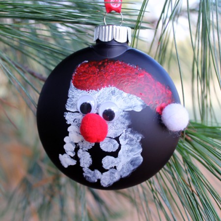 finished handprint ornament on a christmas tree