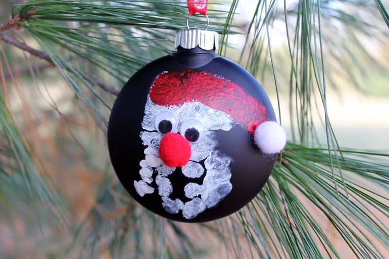 finished handprint ornament on a christmas tree