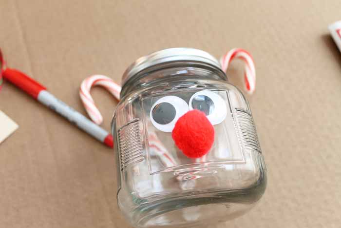 google eyes and pom pom glued to the front of a jar
