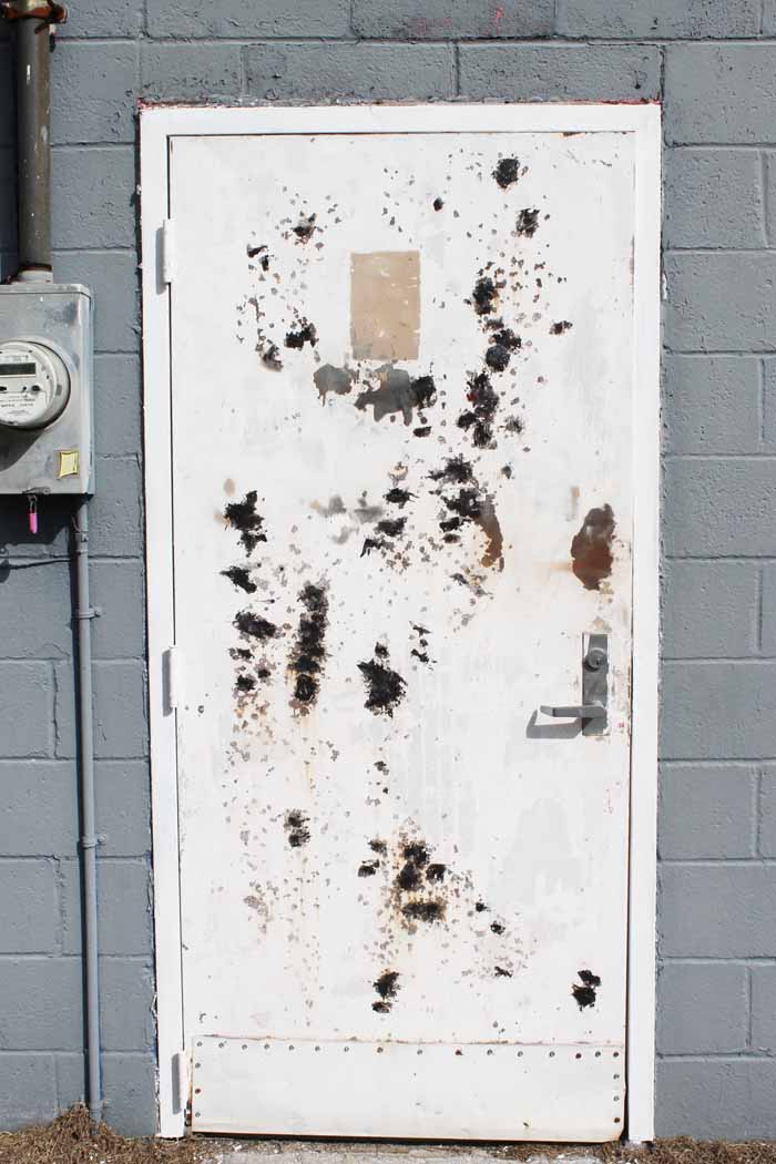 patching a steel door with rusty spots