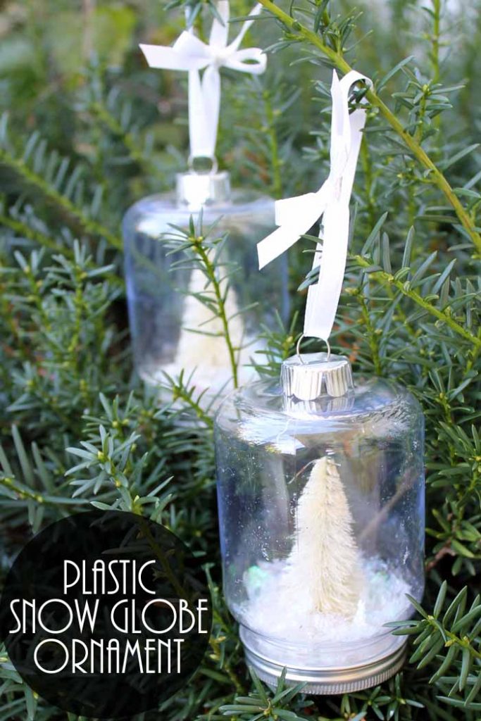 plastic snow globes on a tree