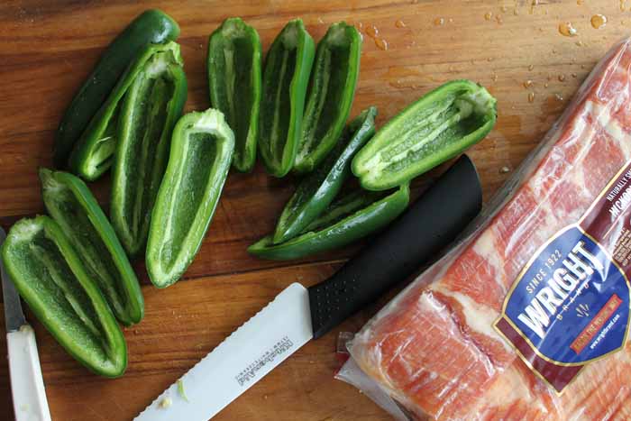 cutting jalapeno peppers in half