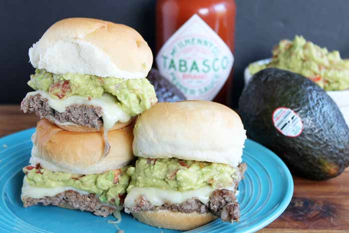 hamburger sliders stacked on a plate