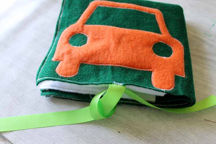 folded car play mat with ribbon closure