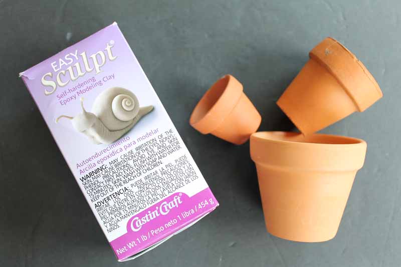 clay pots and easy sculpt clay on a table