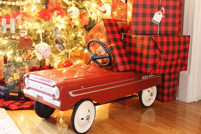 red metal car with presents inside