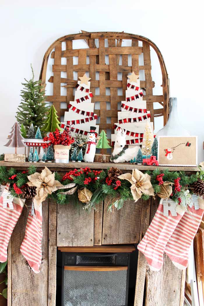 christmas decor on a barnwood mantel