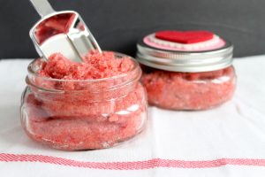 adding sugar scrub to a mason jar