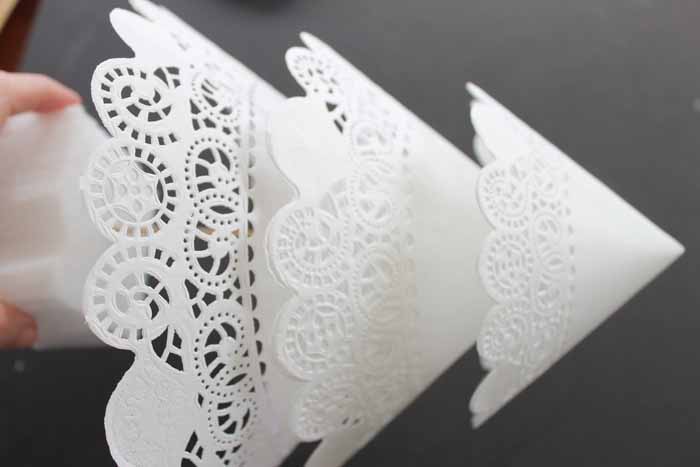three doilies of different sizes stacked on a wood skewer