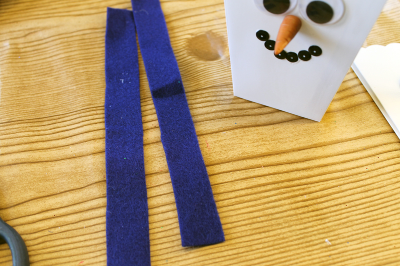 cutting felt scarf for a snowman