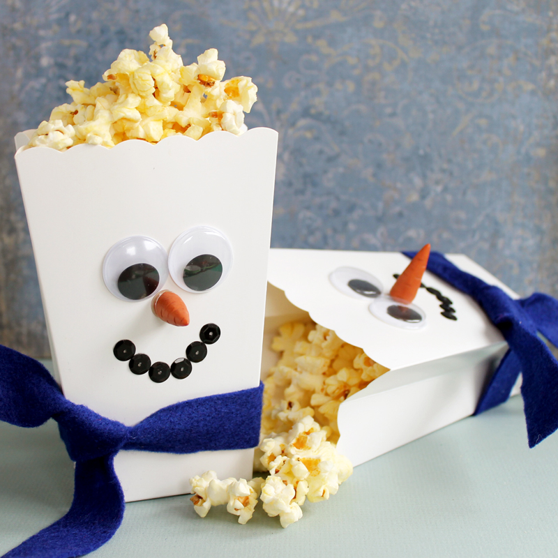 snowman popcorn boxes on a table