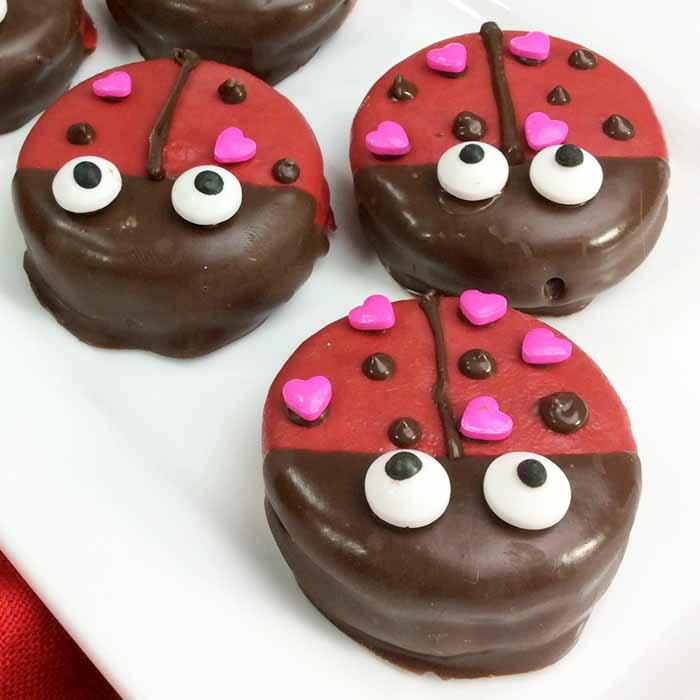 Oreos covered in chocolate and decorated to look like Lady Bugs