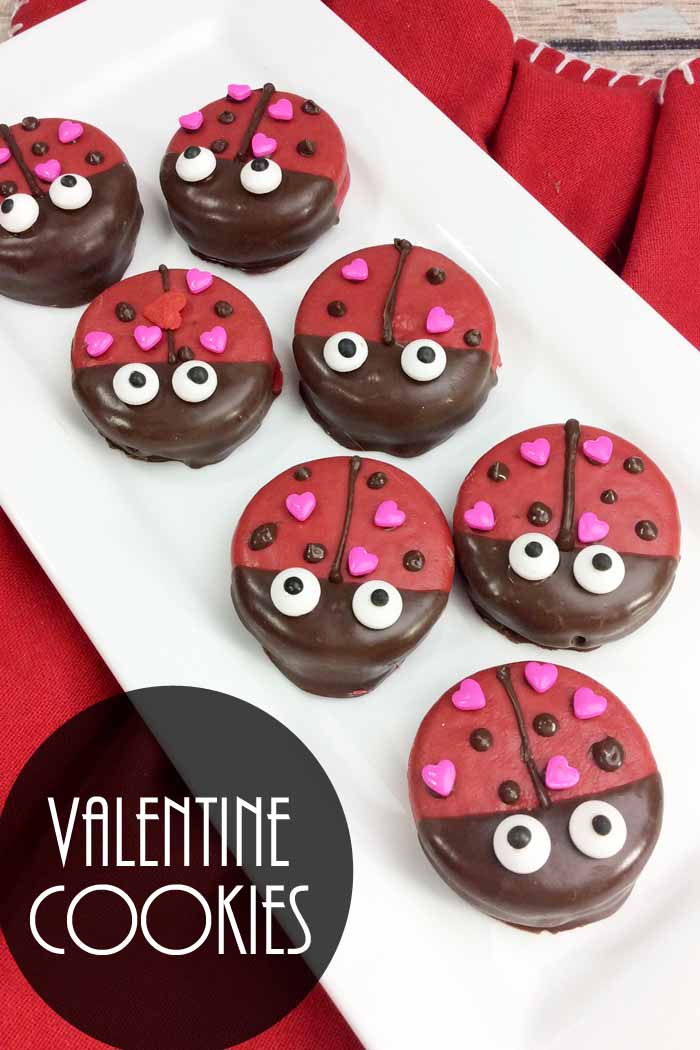 top shot of lady bug oreo valentine cookies on white plate