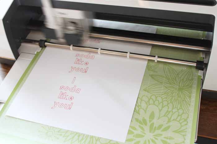 top shot of soda valentines being printed from Cricut machine