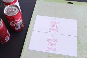 top shot of white paper with i soda like you printed on them
