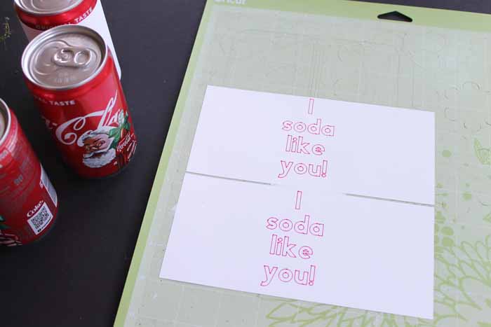 top shot of white paper with i soda like you printed on them