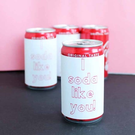 mini soda cans with paper wrapped around that reads i soda like you