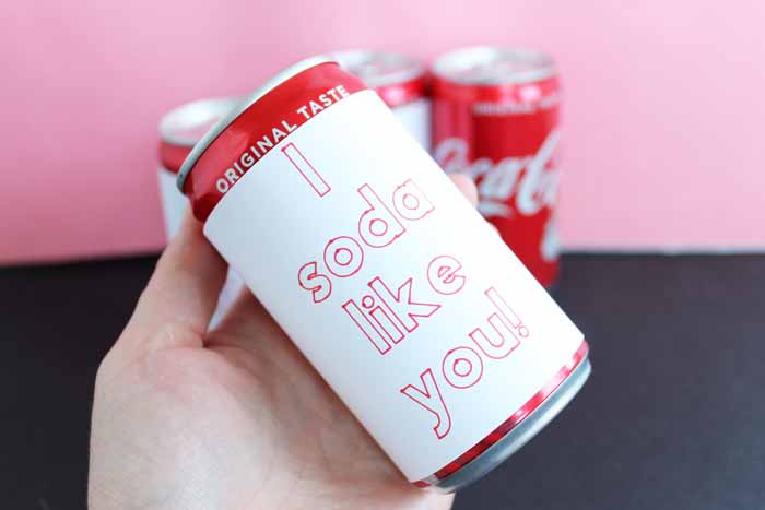 Cricut Valentine idea: mini soda cans with paper wrapped around that reads i soda like you