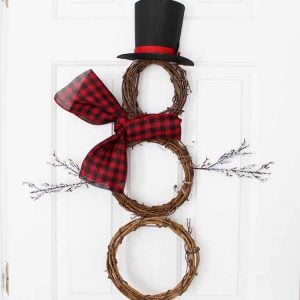 snowman wreath hanging on a door