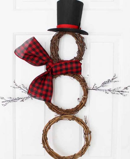 snowman wreath hanging on a door