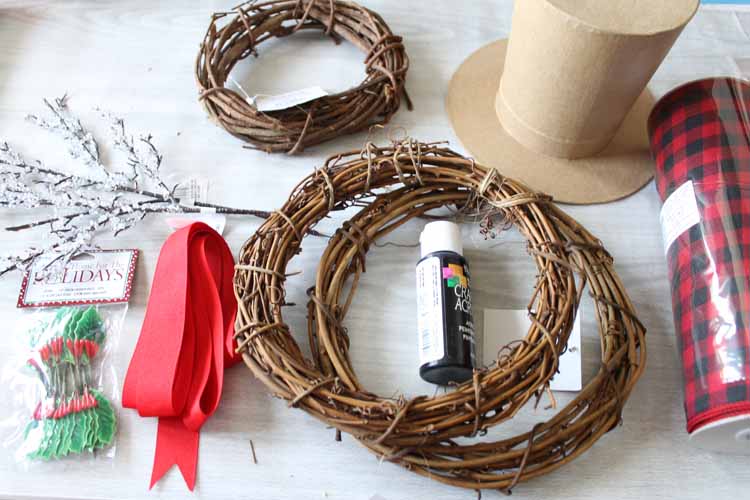 grapevine wreaths and supplies on a table