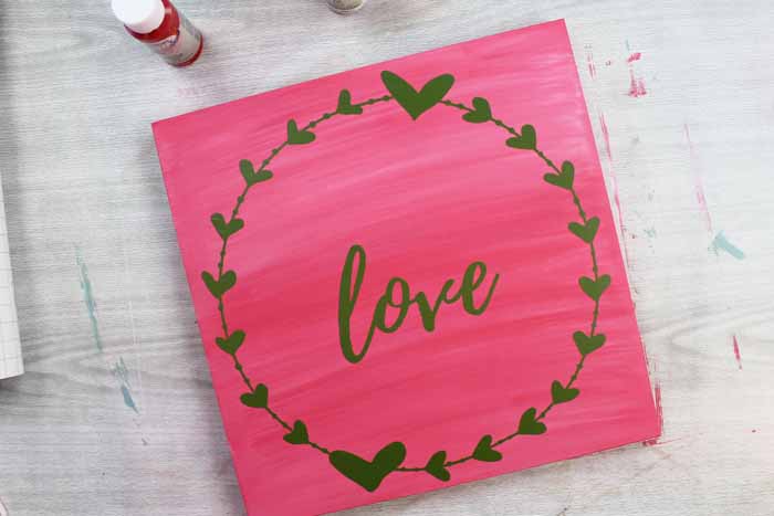 love and heart wreath in vinyl on a wood panel