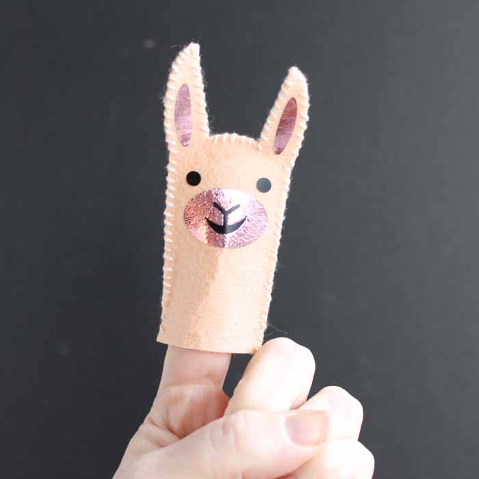 DIY llama finger puppet on a finger