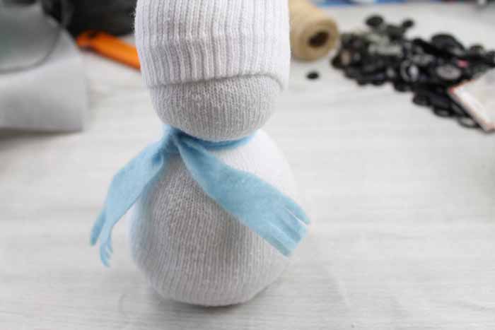 felt scarf on a sock snowman