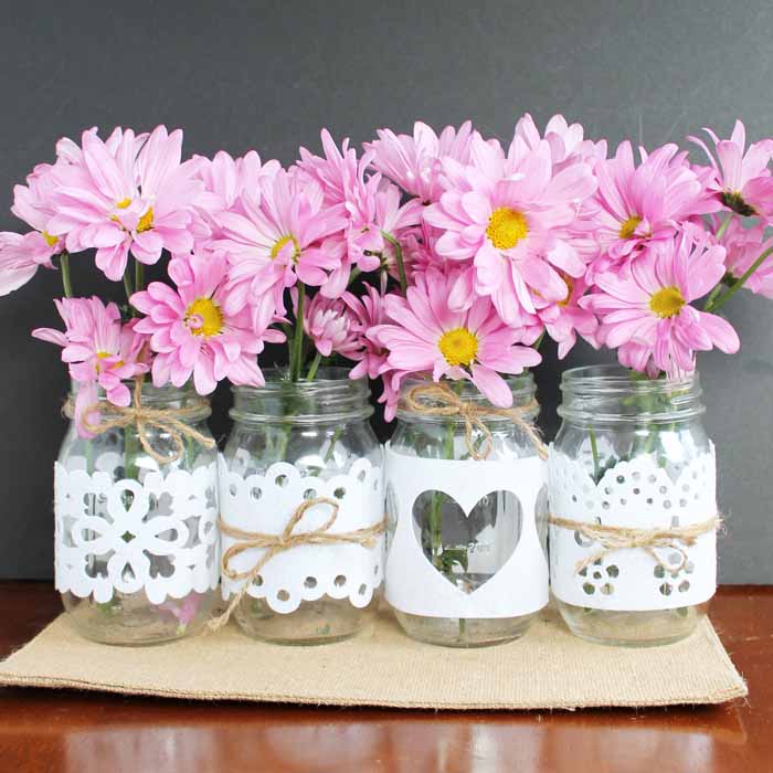 4 jars with white cut felt wrapped around them! Quick, inexpensive, and oh so pretty!