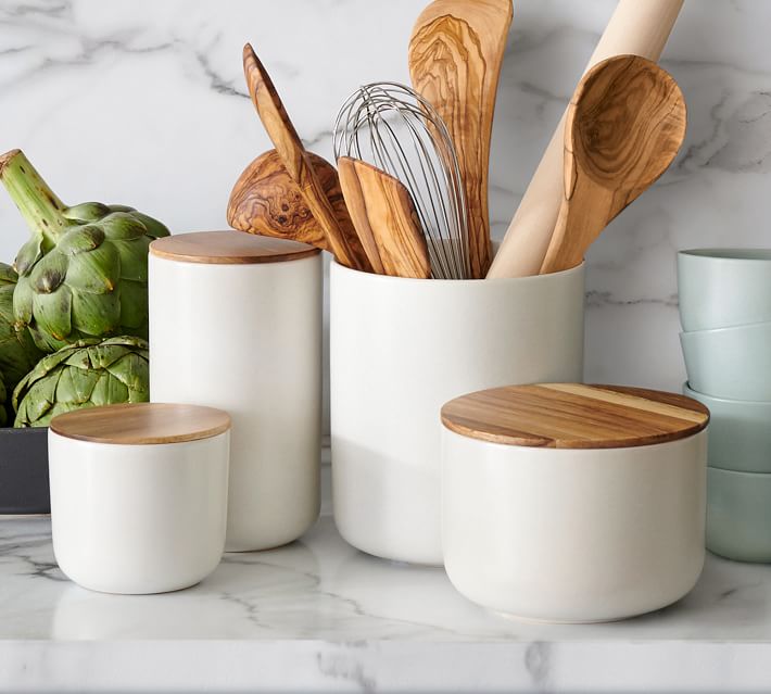 white canisters with wood lids