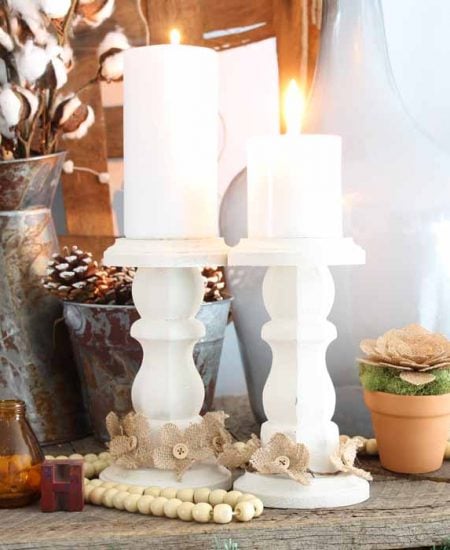 wooden candlesticks on a farmhouse mantel