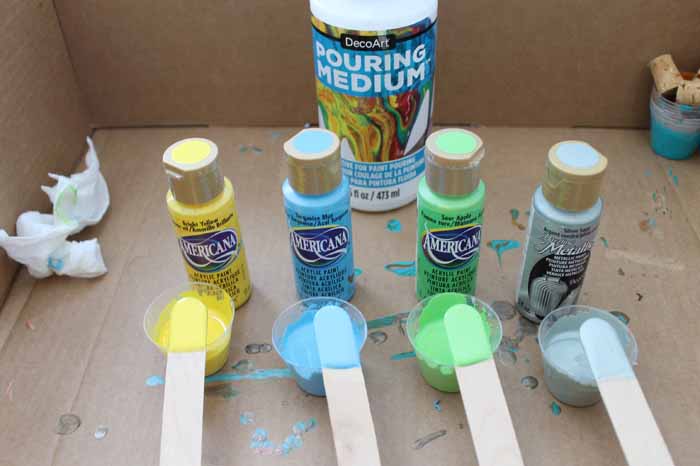 mixing acrylic paints with pouring medium in small cups